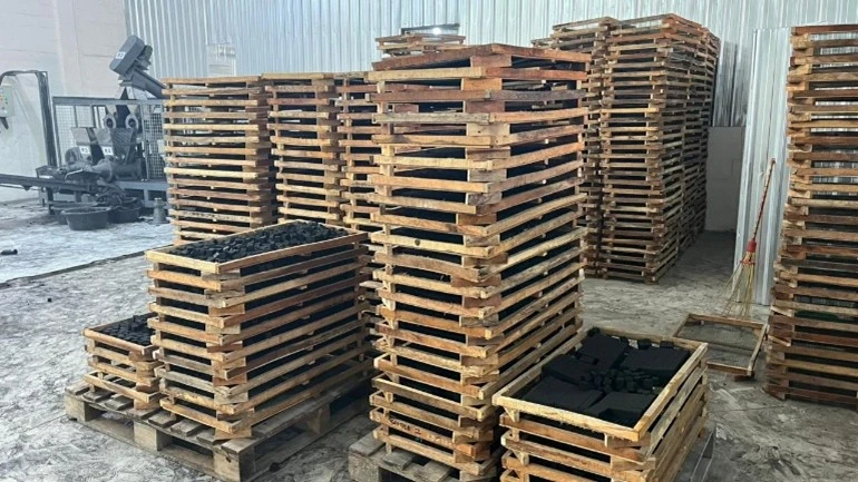 Pre-oven arrangement for charcoal briquettes